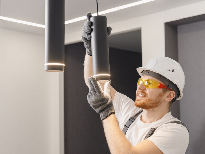 Electrician,Installs,Lamp,Lighting,And,Spot,Loft,Style,On,Ceiling.